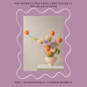 Ikebana floral arrangement with orange tulips